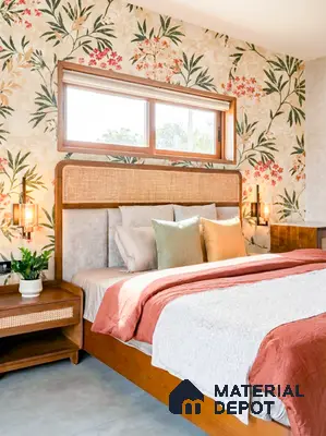Bohemian bedroom with floral wallpaper, natural cane headboard, and warm wood furniture