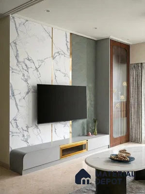 Modern living room with white marble laminate TV unit, gold accent profiles, and grey matte cabinetry