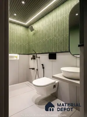 Modern bathroom with sage green patterned wall tiles and matte white floor tiles