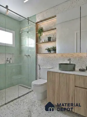 Modern bathroom with mint green geometric wall tile, terrazzo floor and wall tile, and light oak wood vanity
