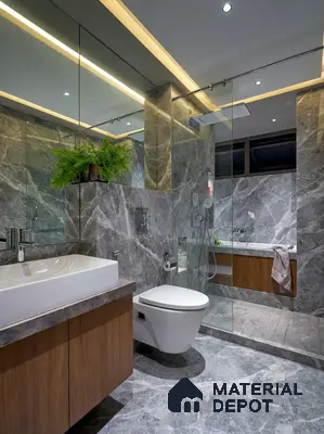 Modern bathroom with grey marble tiles, wooden vanity, and glass shower partition