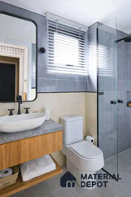 Modern bathroom with grey wall tiles, beige wall tiles, terrazzo countertop, and wood vanity