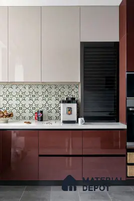Modern kitchen with glossy maroon laminate, beige laminate, white quartz countertop, and green patterned backsplash tile