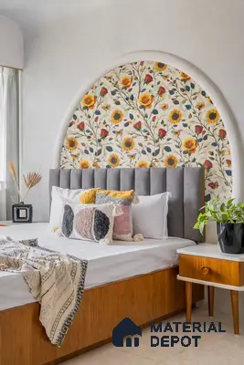 Mid-century modern bedroom with floral wallpaper accent, grey suede upholstered headboard, and walnut wood bed