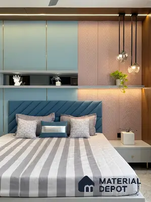 Modern bedroom with pastel blue laminate wardrobe, blush pink fluted wall panels, and upholstered blue headboard