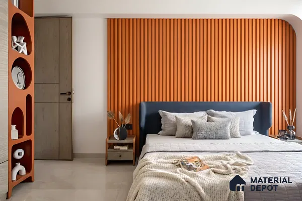 Modern bedroom with orange fluted wall panels and neutral flooring of 3 BHK apartment in Candeur Carlisle Narayanapura Bengaluru