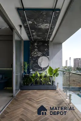 Modern balcony with herringbone wood-look floor tile and terrazzo accent wall panel