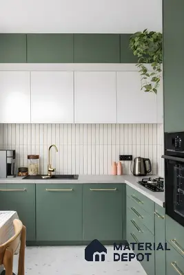 Modern dual tone kitchen with sage green and frosty white laminate, vertical subway backsplash tile, and terrazzo floor tile