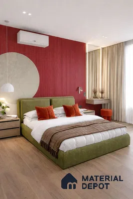 Modern bedroom with olive green upholstered bed, red fluted accent wall, and light oak wooden flooring