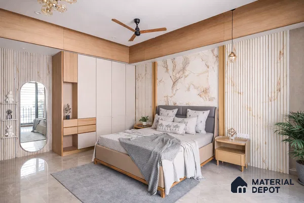 Modern bedroom with marble-look accent wall, beige laminate wardrobe, and light wood details