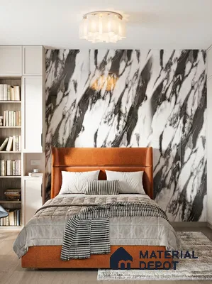 Modern bedroom with bold marble-look accent wall and burnt orange upholstered bed