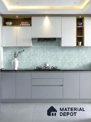 Modern kitchen with frosty white and grey laminate, mint green backsplash tile, and black countertop