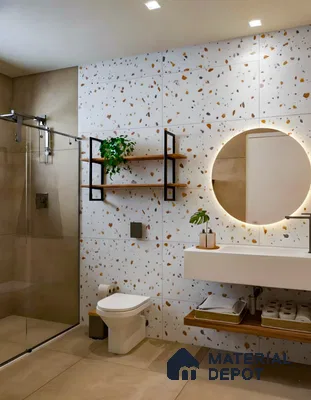 Modern bathroom with terrazzo wall tiles and beige stone floor tiles in Commanders Galaxy Thanisandra Main Road 3 BHK apartment Bengaluru