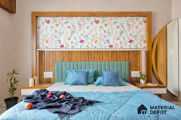 Modern bedroom with floral wallpaper, fluted wood panel headboard, and pastel blue upholstered bed