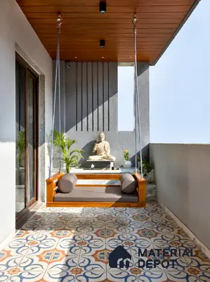Modern balcony with patterned moroccan floor tiles, wooden ceiling panels, and swing seating