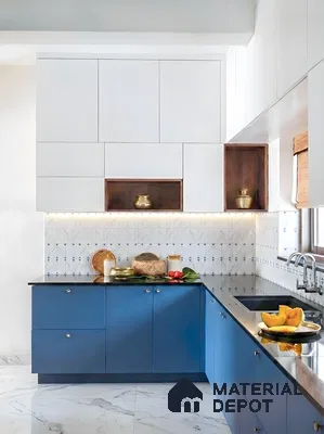 Modern dual tone kitchen with blue and white laminate, geometric patterned backsplash tile, and black granite countertop