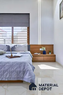 Minimalist bedroom with light wood laminate bed, white marble-look floor tiles, and soft grey bedding of 3 BHK apartment in DSR White Waters Gunjur Bengaluru