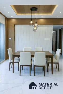 Modern dining room with white marble floor tiles, wood laminate wall paneling, and wooden dining set of 3 BHK apartment in DSR White Waters Gunjur Bengaluru