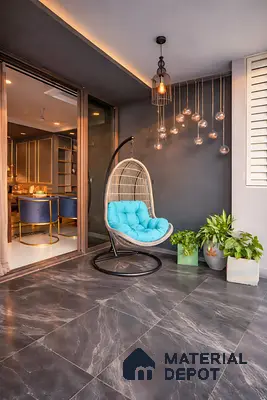 Modern balcony with dark marble floor tiles and rattan swing chair