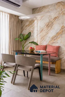 Eclectic dining room with marble-look wall tile, taupe floor tile, and multicolor dining table