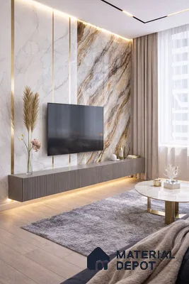Modern living room with marble-look laminate TV wall, gold accent profiles, and light oak wooden flooring