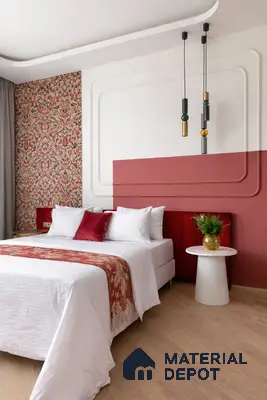 Eclectic bedroom with patterned wallpaper, terracotta accent wall, and light oak wooden flooring