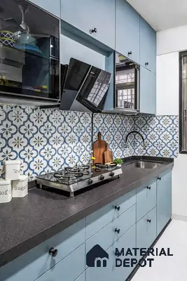 Modern kitchen with pastel blue laminate cabinets and blue geometric patterned backsplash tiles