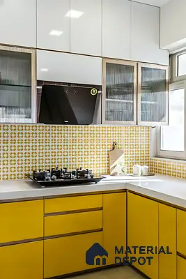 Modern kitchen with yellow solid color laminate, white quartz countertop, and yellow geometric patterned backsplash tiles of 2 BHK apartment in DNR Casablanca Narayanapura Bengaluru