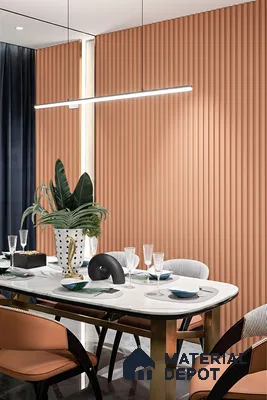 Modern dining room with terracotta fluted wall panels and white marble dining table of 3 BHK apartment in Dsr lotus towers whitefield Bengaluru