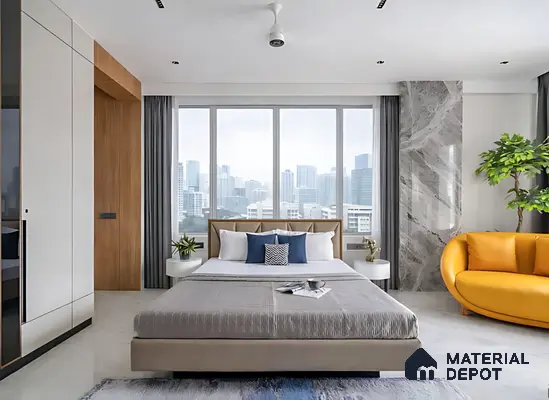 Modern bedroom with beige upholstered bed, marble accent wall, and white high gloss wardrobe