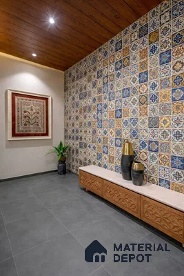 Mediterranean foyer with patterned moroccan wall tiles, carved wood bench, and grey floor tiles