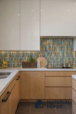 Modern kitchen with white high gloss laminate, light oak wood laminate, and multicolor vertical kitkat backsplash tiles