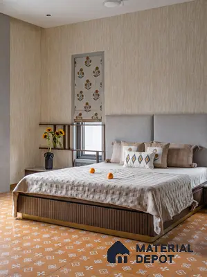 Scandinavian bedroom with beige textured wallpaper, patterned mustard floor tiles, and upholstered headboard