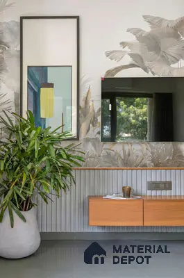 Modern TV unit with botanical wallpaper, fluted wall panels, and light wood laminate cabinet
