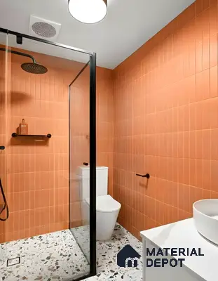 Modern bathroom with terracotta kitkat wall tiles and terrazzo floor tiles in Fortuna Central Park Virupakshapura 3 BHK apartment Bengaluru