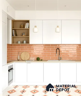 Scandinavian kitchen with white laminate cabinets, terracotta subway backsplash tile, and geometric patterned floor tile in Fortuna Central Park Virupakshapura 3 BHK apartment Bengaluru