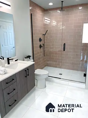 Modern bathroom with blush pink subway wall tiles, white floor tiles, and wood grain laminate vanity in 3 BHK apartment GK Lake View Anantapuram Bengaluru