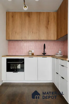 Scandinavian kitchen with oak wood laminate cabinets, pink kitkat backsplash tile, and white matte base cabinets