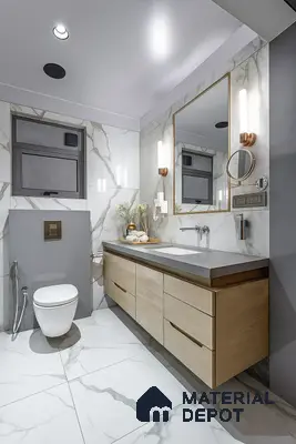 Modern bathroom with marble-look wall and floor tiles, light wood vanity, and grey countertop of 3 BHK apartment in Garuda Royal Homes KR Puram in Bengaluru