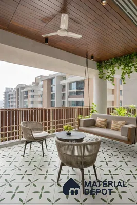 Modern balcony with wooden ceiling, patterned green and white floor tiles, and rattan furniture