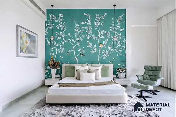 Modern bedroom with teal chinoiserie wallpaper, suede upholstered bed, and sage green accent chair
