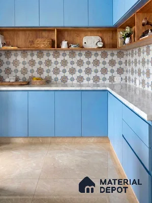 Modern kitchen with pastel blue laminate cabinets, moroccan patterned backsplash tile, and marble countertop