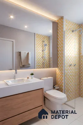 Modern bathroom with yellow geometric wall tiles and light wood vanity
