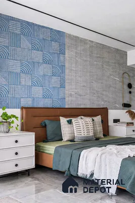 Modern bedroom with blue geometric patterned accent wall tile and grey marble wall tile