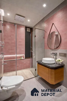 Modern bathroom with blush pink subway wall tiles, grey floor tiles, and wood vanity with black granite countertop