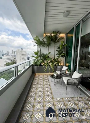 Modern balcony with patterned geometric floor tiles and outdoor seating