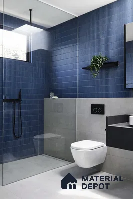 Modern bathroom with blue kitkat wall tiles and light grey floor tiles