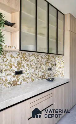 Modern kitchen with gold marble patterned backsplash tiles, light oak laminate cabinets, and fluted glass shutters