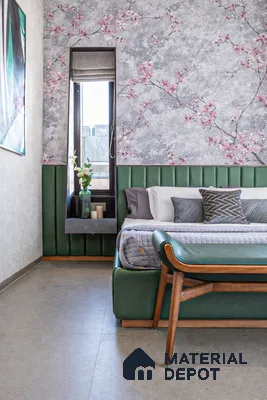 Modern bedroom with floral wallpaper, green upholstered headboard, and grey floor tile
