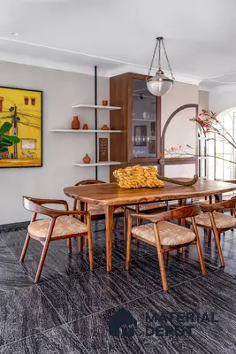 Mid-century modern dining room with walnut wood dining set and black marble floor tiles